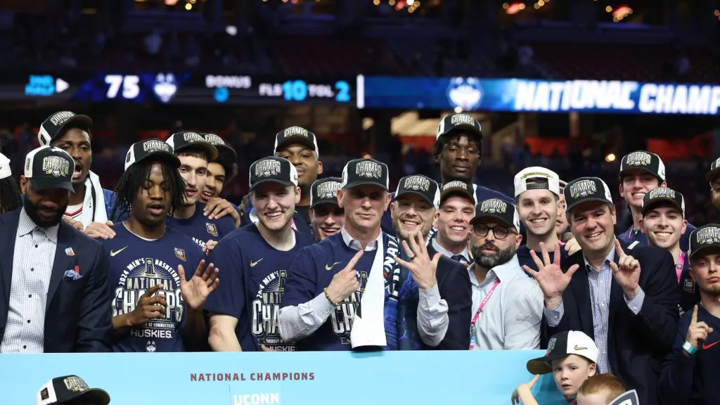 Head coach Dan Hurley of the Connecticut Huskies celebrates with his team during the trophy ceremony after beating the Purdue Boilermakers 75-60 to win the NCAA Men’s Basketball Tournament National Championship game at State Farm Stadium on April 08, 2024 in Glendale, Arizona.