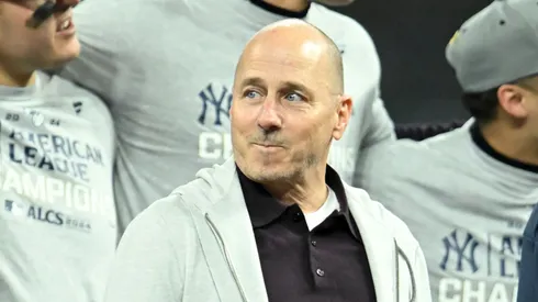 New York Yankees general manager Brian Cashman looks on during the trophy ceremony after the Yankees beat the Cleveland Guardians 5-2 in 10 innings in Game Five of the American League Championship Series at Progressive Field on October 19, 2024 in Cleveland, Ohio.