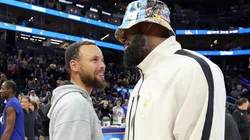 Stephen Curry #30 of the Golden State Warriors talks with LeBron James #23 of the Los Angeles Lakers after their preseason game at Chase Center on October 18, 2024 in San Francisco, California.