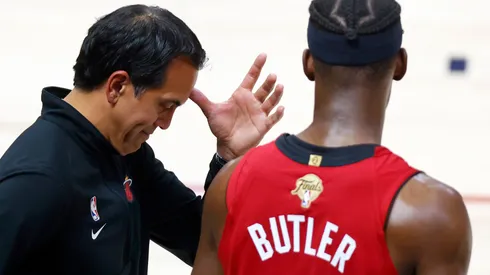 Head coach Erik Spoelstra of the Miami Heat reacts with Jimmy Butler #22 during the fourth quarter against the Denver Nuggets in Game Five of the 2023 NBA Finals at Ball Arena on June 12, 2023 in Denver, Colorado.