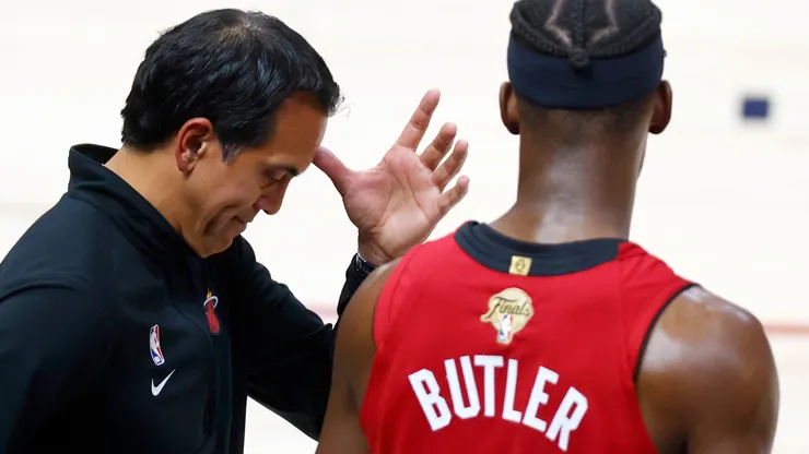 Head coach Erik Spoelstra of the Miami Heat reacts with Jimmy Butler #22 during the fourth quarter against the Denver Nuggets in Game Five of the 2023 NBA Finals at Ball Arena on June 12, 2023 in Denver, Colorado.
