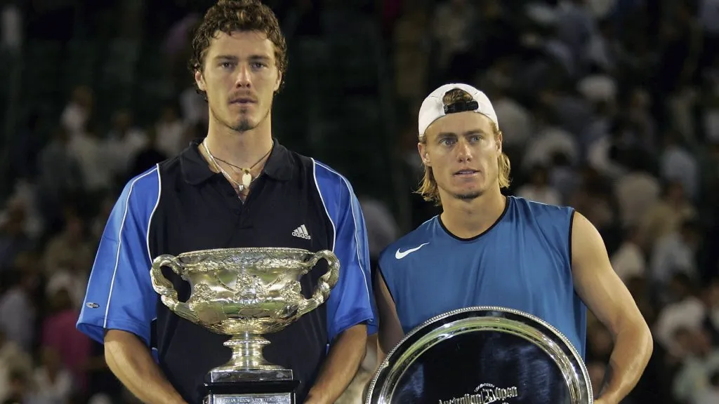 Marat Safin of Russia and Lleyton Hewitt of Australia pose for photographers after the Men’s Final during day fourteen of the Australian Open Grand Slam at Melbourne Park. (Sean Garnsworthy/Getty Images)