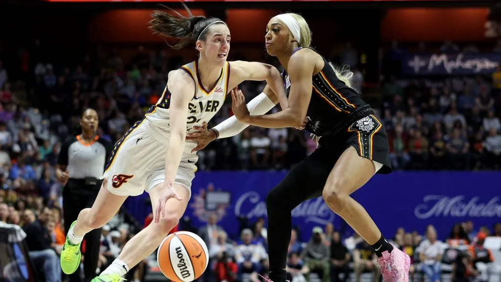 dijonai carrigton and caitlin clark dribbling