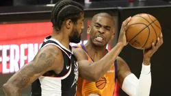 Chris Paul #3 of the Phoenix Suns drives to the basket against Paul George #13 of the LA Clippers during the first half in game three of the Western Conference Finals at Staples Center on June 24, 2021 in Los Angeles, California.