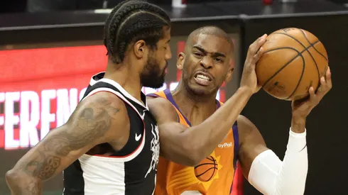 Chris Paul #3 of the Phoenix Suns drives to the basket against Paul George #13 of the LA Clippers during the first half in game three of the Western Conference Finals at Staples Center on June 24, 2021 in Los Angeles, California.