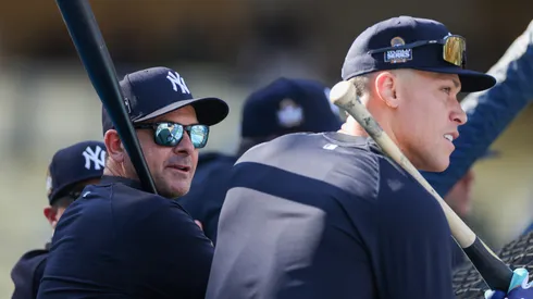 Aaron Boone #17 and Aaron Judge #99 of the New York Yankees look on during batting practice ahead of Game Two of the 2024 World Series between the Los Angeles Dodgers and the New York Yankees at Dodger Stadium on October 26, 2024 in Los Angeles, California.