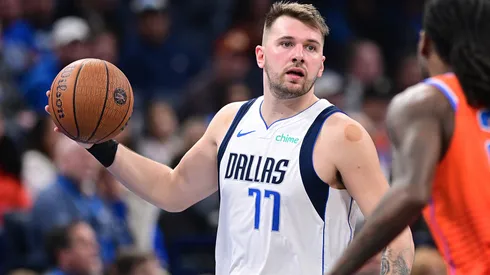 Luka Doncic #77 of the Dallas Mavericks handles the ball in front of Cason Wallace #22 of the Oklahoma City Thunder during the second half at Paycom Center.