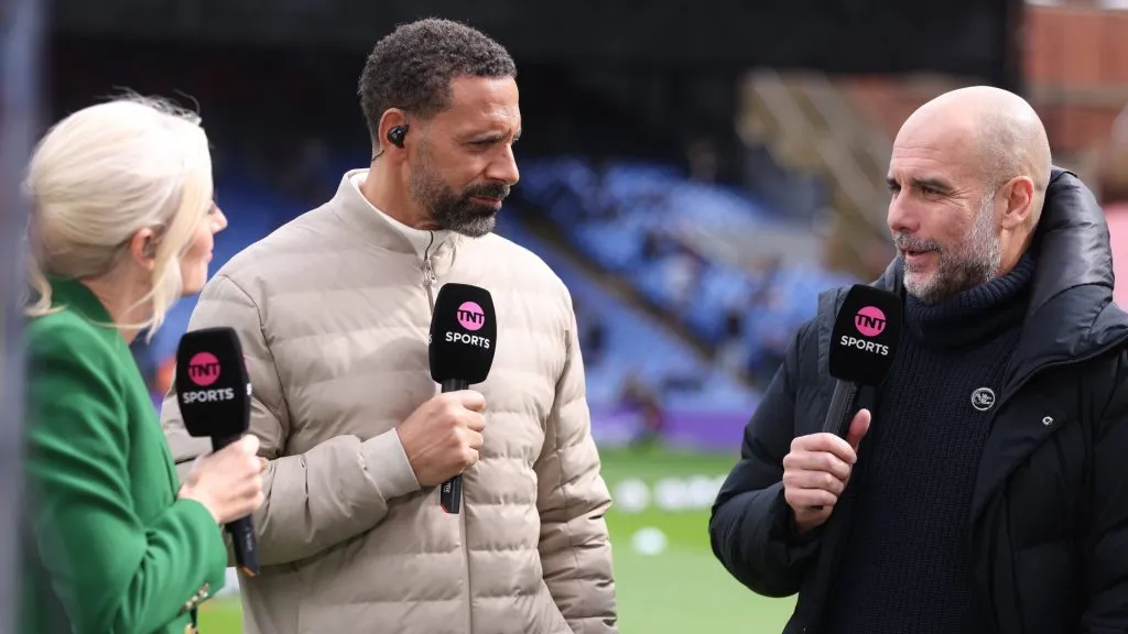 Pep Guardiola, Manager of Manchester City talks with TNT Sports presenters Lynsey Higgrave and Rio Ferdinand during the Premier League match at Selhurst Park, London.