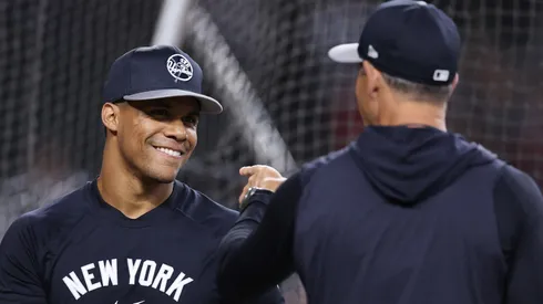 uan Soto #22 of the New York Yankees talks with manager Aaron Boone before the MLB game against the Arizona Diamondbacks at Chase Field on April 01, 2024 in Phoenix, Arizona.