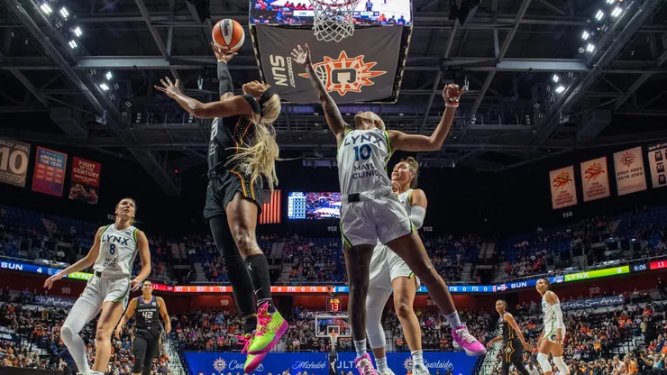 Connecticut Sun guard forward DiJonai Carrington (21) shoots a reverse layup during game 3 of the semifinals of the WNBA playoffs between the Minnesota Lynx and the Connecticut Sun on October 4, 2024.