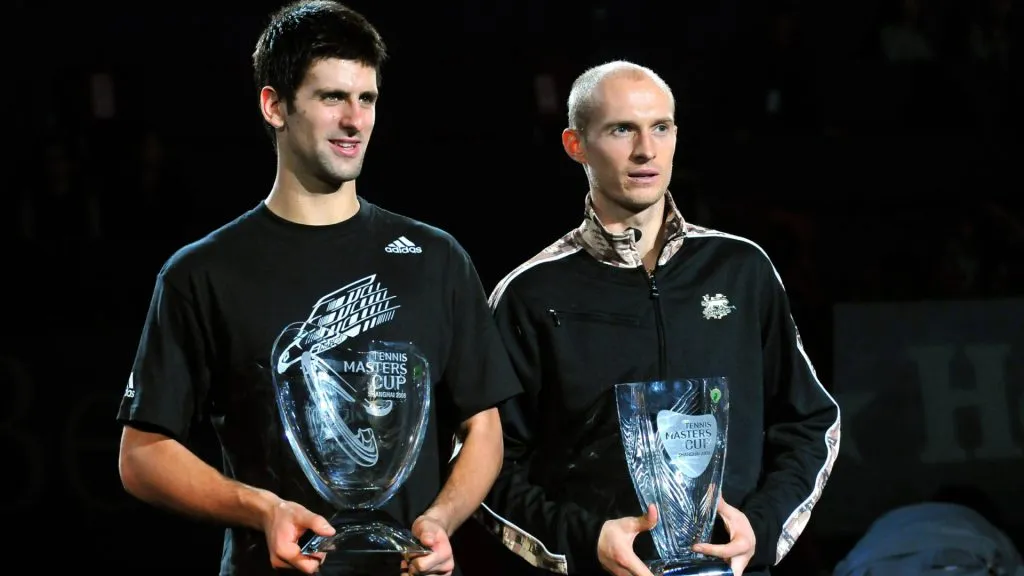Champion Novak Djokovic and runner-up Nikolay Davydenko pose with their trophies after the final match of the Tennis Masters Cup. (IMAGO / Imaginechina)