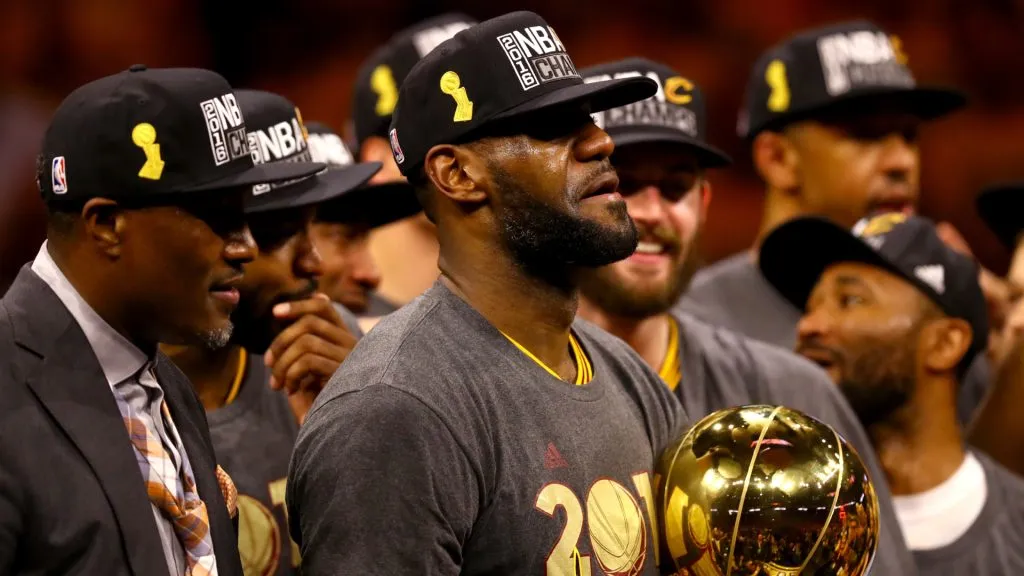 LeBron James #23 of the Cleveland Cavaliers holds the Larry O’Brien Championship Trophy after defeating the Golden State Warriors 93-89 in Game 7 of the 2016 NBA Finals. (Ezra Shaw/Getty Images)