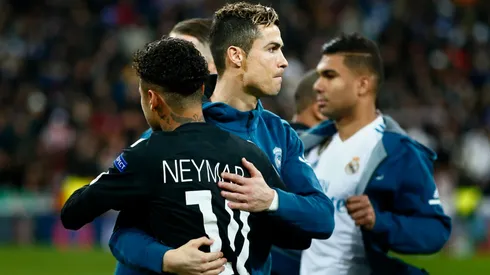 Cristiano Ronaldo (L) of Real Madrid CF hugs Neymar JR (R) of Paris Saint-Germain prior to start the UEFA Champions League Round of 16 First Leg match between Real Madrid and Paris Saint-Germain at Estadio Santiago Bernabeu on February 14, 2018 in Madrid, Spain.