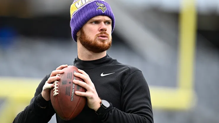Sam Darnold #14 warms up before playing the Chicago Bears at Soldier Field on November 24, 2024.