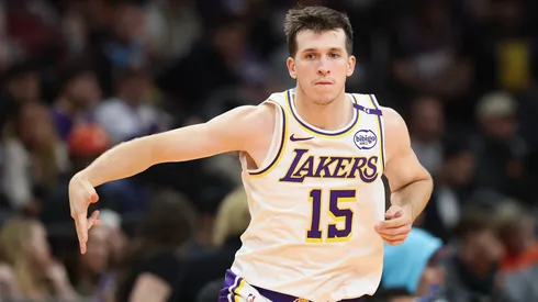 Austin Reaves #15 of the Los Angeles Lakers reacts to a three-point shot against the Phoenix Sunsduring the second half of the Emirates NBA Cup game at Footprint Center