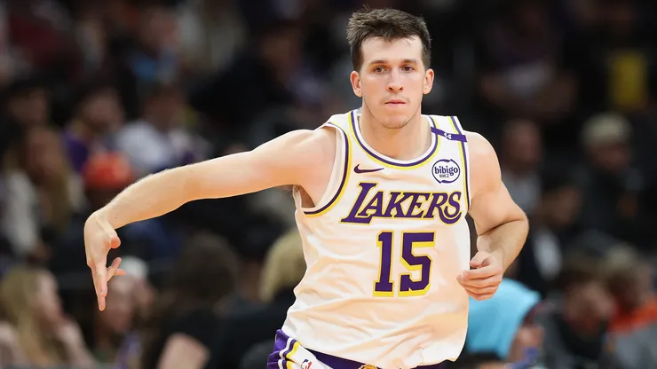 Austin Reaves #15 of the Los Angeles Lakers reacts to a three-point shot against the Phoenix Sunsduring the second half of the Emirates NBA Cup game at Footprint Center