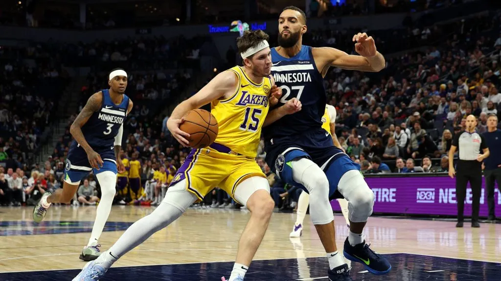 Austin Reaves #15 of the Los Angeles Lakers goes to the basket against Rudy Gobert #27 of the Minnesota Timberwolves in the fourth quarter at Target Center. (David Berding/Getty Images)