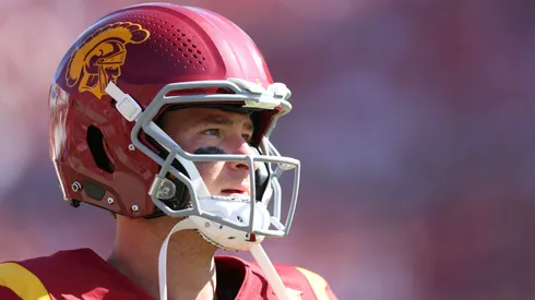 Southern California quarterback MILLER MOSS (7) warms up by the sideline while waiting for play to resume during a NCAA, College League, USA football game between Wisconsin and Southern California at the Los Angeles Memorial Coliseum in Los Angeles, California.