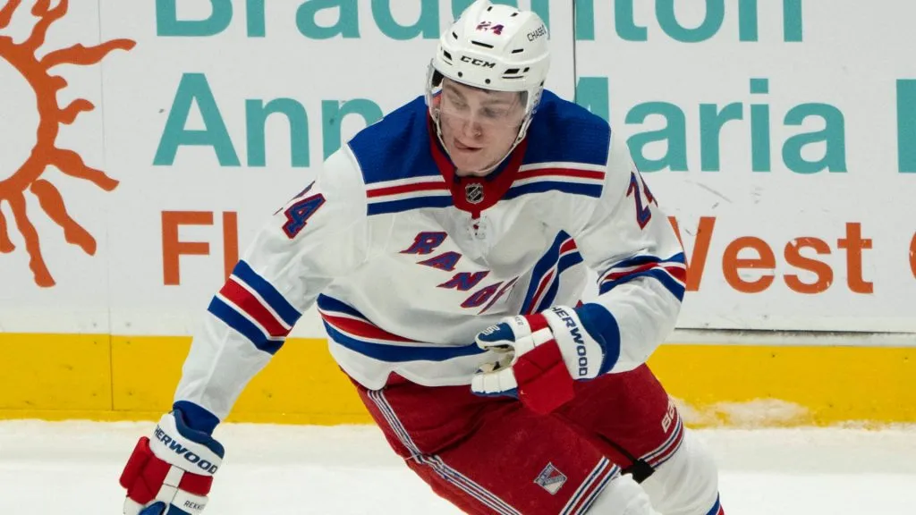 New York Rangers Right Wing Kaapo Kakko (24) reaches for the puck during the second period of the National Hockey League game between the New York Rangers and the New York Islanders on May 1, 2021, at the Nassau Veterans Memorial Coliseum in Uniondale, NY.