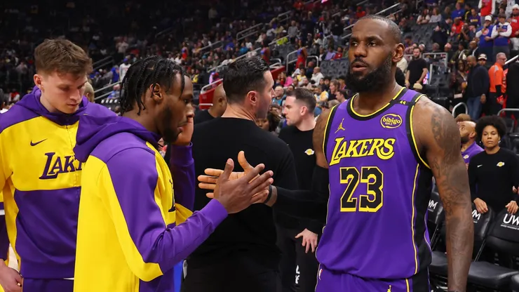 LeBron James #23 and Bronny James #9 of the Los Angeles Lakers prior to playing the Detroit Pistons at Little Caesars Arena on November 04, 2024 in Detroit, Michigan.