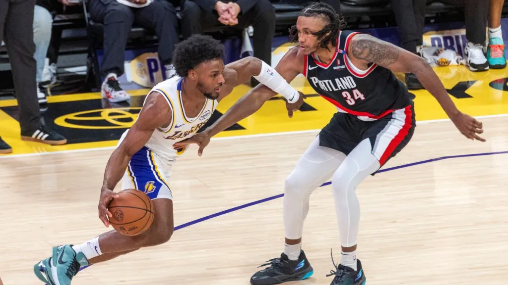 Bronny James drives against Portland Trail Blazers Jabari Walker during an NBA regular season game. (IMAGO / ZUMA Press Wire)