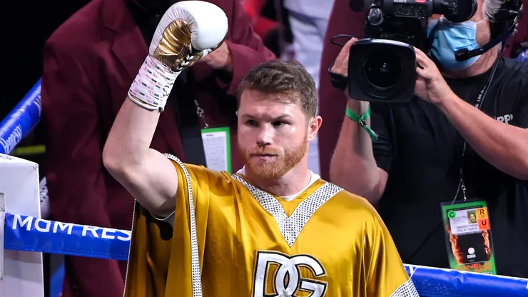Canelo Alvarez acknowledges the crowd while celebrating after his 11th round technical knock out win of Caleb Plant after their championship bout for Alvarez's WBC, WBO and WBA super middleweight titles and Plant's IBF super middleweight title at MGM Grand Garden Arena.