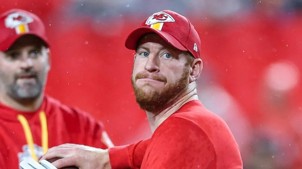Carson Wentz (11) warms up before a game against the Tampa Bay Buccaneers at GEHA Field at Arrowhead.