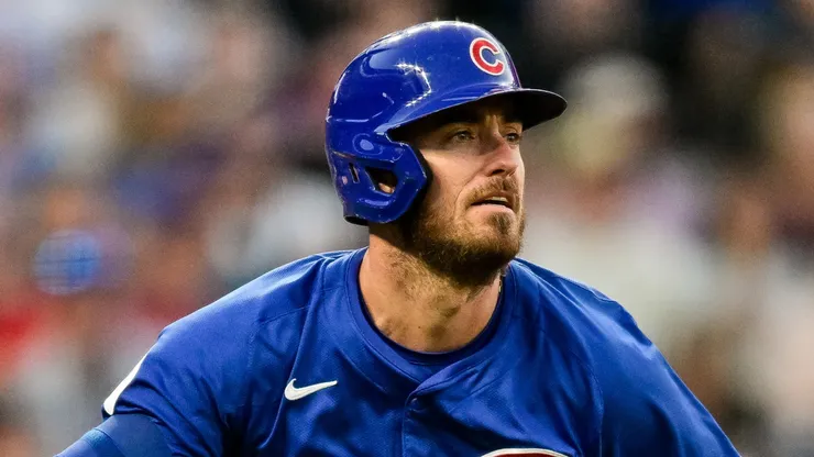 Cody Bellinger #24 of the Chicago Cubs follows the flight of his fourth inning solo home run against the Colorado Rockies at Coors Field on September 14, 2024 in Denver, Colorado.