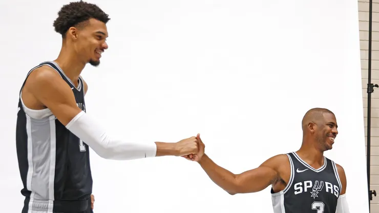 Victor Wembanyama #1 of the San Antonio Spurs and Chris Paul #3 prepare to have their photograph taken at the San Antonio Spurs Media Day at the Victory Capital Performance Center on September 30, 2024 in San Antonio, Texas.