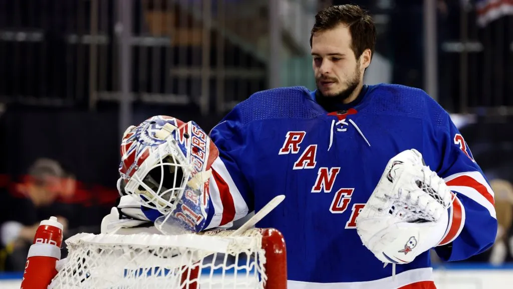 Igor Shesterkin #31 of the New York Rangers picks up his helmet during the game against the Columbus Blue Jackets at Madison Square Garden on February 28, 2024. (Source: Sarah Stier/Getty Images)