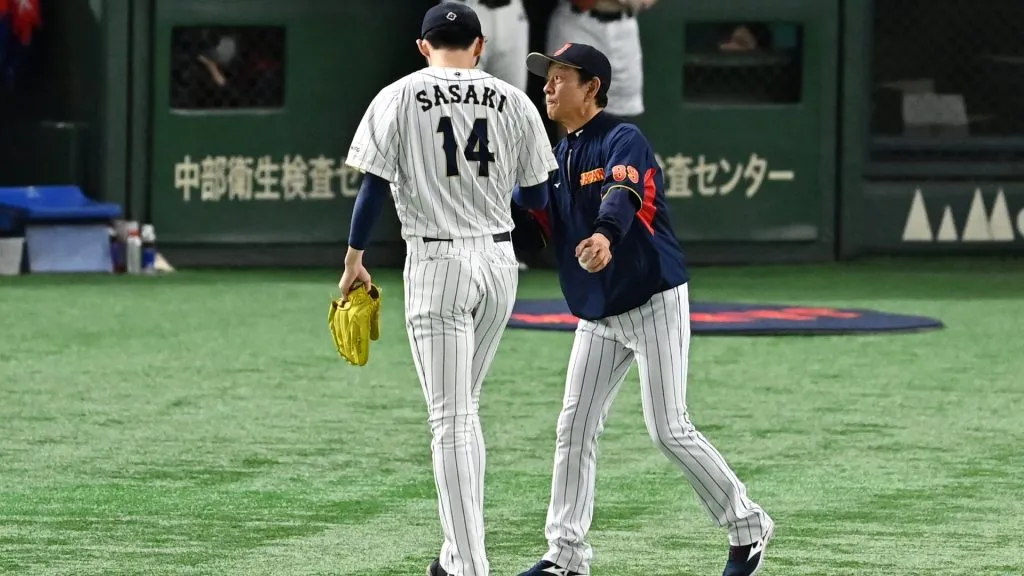 Roki Sasaki #14 of Japan is congratulated by Manager Hideki Kuriyama #89 after his withdrawal in the fourth inning during the World Baseball Classic Pool B game between Czech Republic and Japan at Tokyo Dome on March 11, 2023 in Tokyo, Japan. (Photo by Kenta Harada/Getty Images)