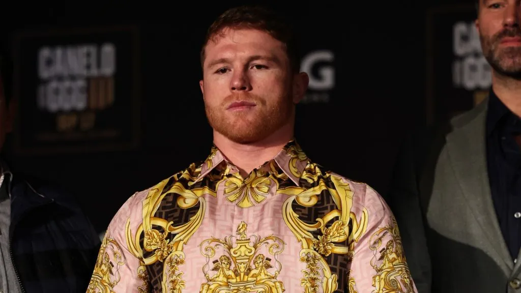 Canelo Alvarez poses with his championship belts at the end of the press conference during the press tour for his fight against Gennady Golovkin on June 27, 2022. (Source: Dustin Satloff/Getty Images)