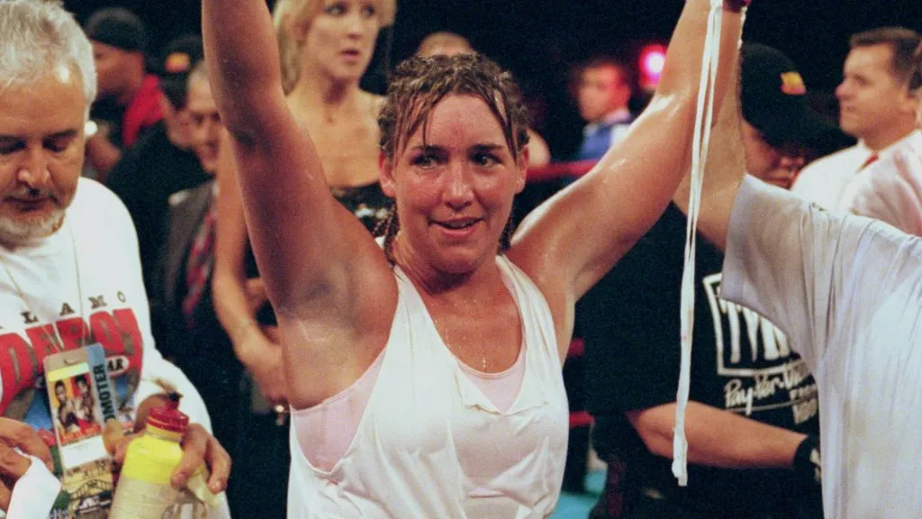 Christy Martin raises her arms in victory after the fight against Kathy Collins at Madison Square Garden in New York, New York. Martin defeated Collins in the 10th round by decision. (Source: Al Bello /Allsport)