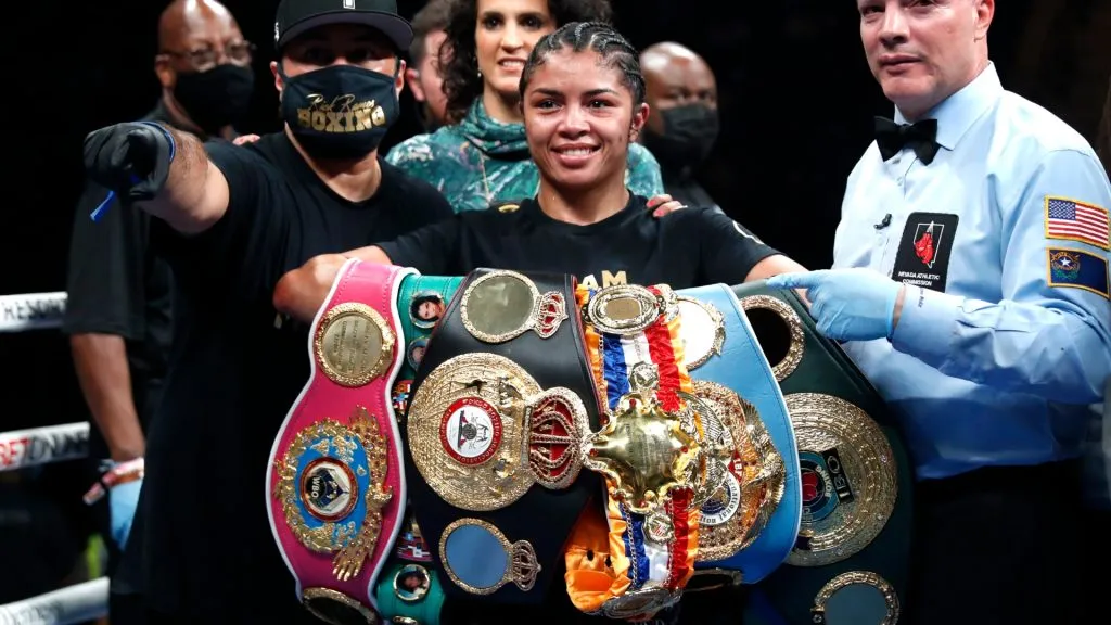 Jessica McCaskill poses with members of her team and referee Celestino Ruiz after defeating Kandi Wyatt at MGM Grand Garden Arena on December 04, 2021. (Source: Steve Marcus/Getty Images)