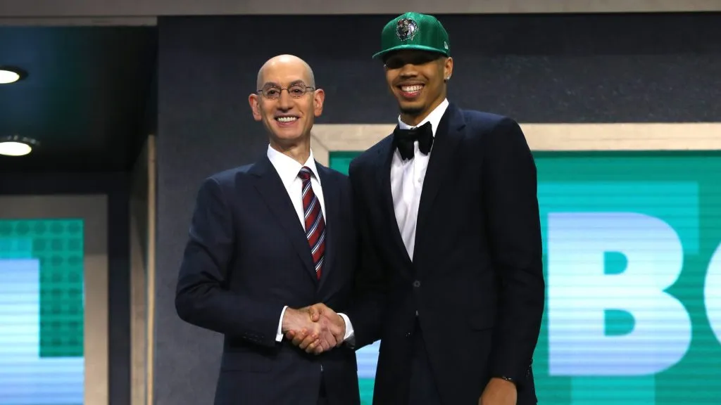 Jayson Tatum walks on stage with NBA commissioner Adam Silver after being drafted third overall by the Boston Celticsduring the first round of the 2017 NBA Draft. (Mike Stobe/Getty Images)