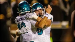 Coastal Carolina Chanticleers quarterback Grayson McCall celebrates with tight end Kendall Karr
