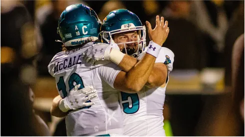 Coastal Carolina Chanticleers quarterback Grayson McCall celebrates with tight end Kendall Karr