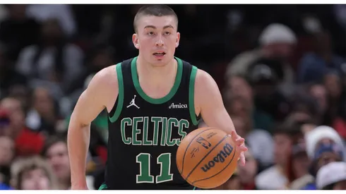 Payton Pritchard 11 of the Boston Celtics brings the ball up court during the second half against the Chicago Bulls on December 21, 2024 at the United Center in Chicago, Illinois.