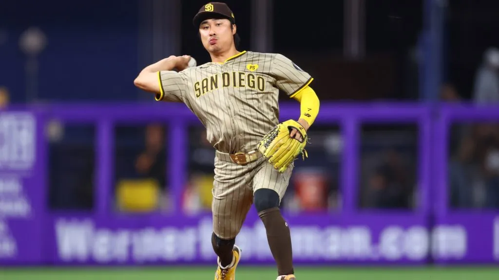 Ha-Seong Kim #7 of the San Diego Padres throws to first base for an out against the Miami Marlins during the ninth inning of the game at loanDepot park on August 09, 2024 in Miami, Florida. (Photo by Megan Briggs/Getty Images)