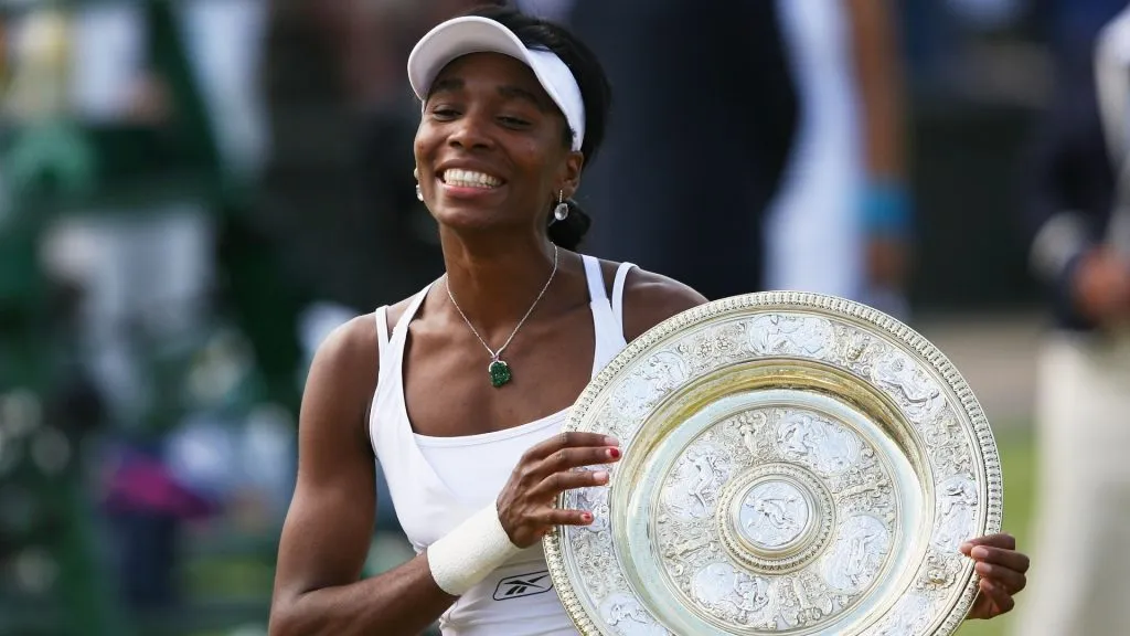Venus Williams poses with the trophy following her victory during the Women’s Singles final match against Marion Bartoli of France during day twelve of the Wimbledon Lawn Tennis Championships in 2007. (Source: Clive Brunskill/Getty Images)