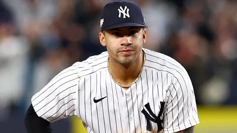 Gleyber Torres #25 of the New York Yankees celebrates making the last out of the play to beat the Cleveland Guardians in game five of the American League Division Series at Yankee Stadium on October 18, 2022 in New York, New York.