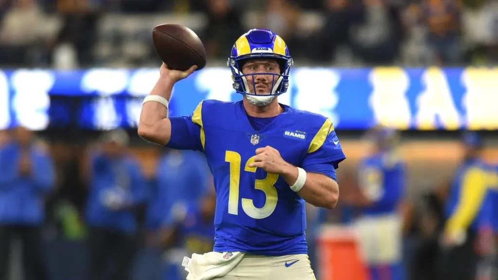 Los Angeles Rams quarterback John Wolford (13) rolls out of the pocket and looks to pass during an NFL, American Football Herren, USA game between the Seattle Seahawks and the Los Angeles Rams on December 04, 2022, at SoFi Stadium in Inglewood, CA.