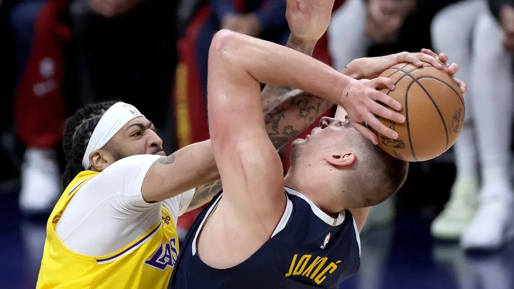 Anthony Davis #3 of the Los Angeles Lakers blocks Nikola Jokic #15 of the Denver Nuggets in the fourth quarter during game five of the Western Conference First Round Playoffs at Ball Arena. (Matthew Stockman/Getty Images)