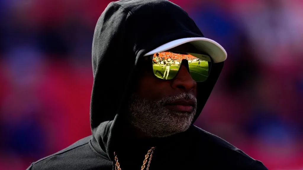 Head coach Deion Sanders of the Colorado Buffaloes watches his team warm up prior to a game against the Kansas Jayhawks at Arrowhead Stadium on November 23, 2024. (Source: Ed Zurga/Getty Images)