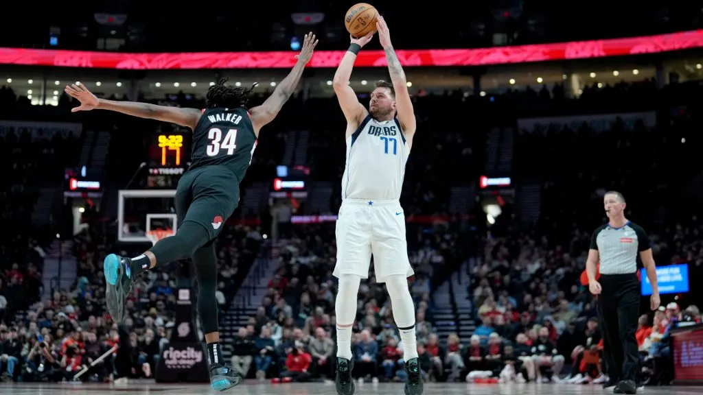 Luka Doncic #77 of the Dallas Mavericks shoots the ball over Jabari Walker #34 of the Portland Trail Blazers during the first half at Moda Center. (Soobum Im/Getty Images)