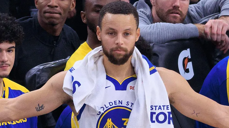 Stephen Curry 30 of the Golden State Warriors reacts to plays from the sidelines during their regular season NBA matchup against the Los Angeles Clippers.