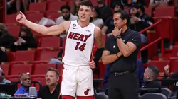 Miami Heat head coach Erik Spoelstra talks with guard Tyler Herro during his game against the New Orleans Pelicans.