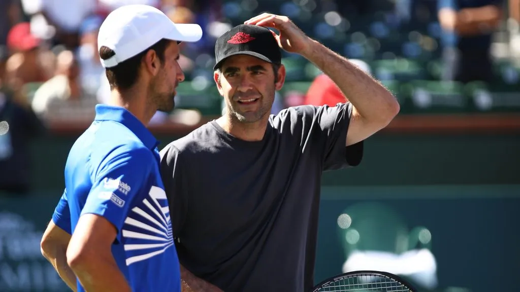 Novak Djokovic and Pete Sampras chat after their exhibition doubles match at the Indian Wells Tennis Garden. (Clive Brunskill/Getty Images)
