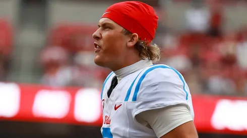Ole Miss QB Jaxson Dart 2 comes off the bench to congratulate the defense following a defensive touchdown. Ole Miss defeated Arkansas 63-31cin Fayetteville, AR.