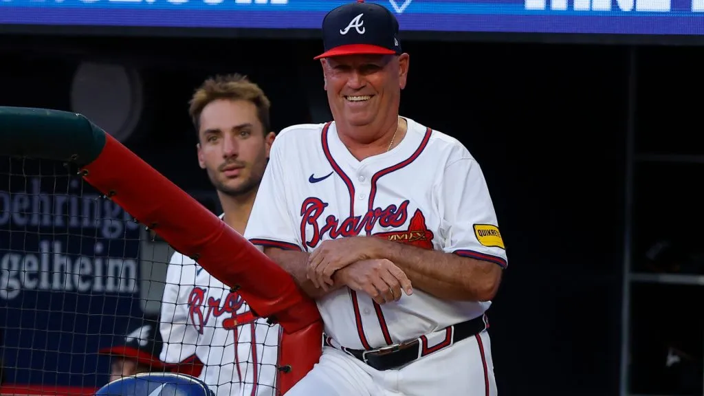 Manager Brian Snitker of the Atlanta Braves reacts after being hit by a ball in the dugout in the fifth inning against the San Francisco Giants at Truist Park on July 3, 2024. (Source: Todd Kirkland/Getty Images)